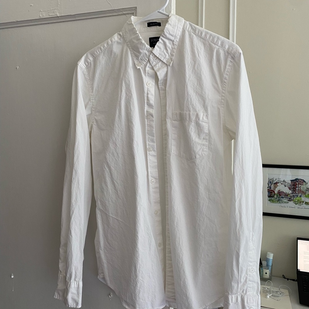 A casual J.Crew long sleeve white button down shirt.